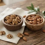 Walnuts vs almonds comparison showing raw nuts side by side for a healthy nuts comparison with natural nutrition-rich foods.